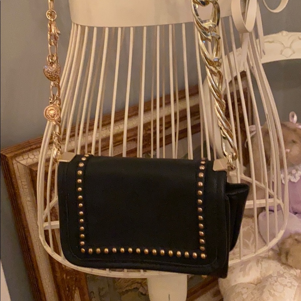 Free People purse with heavy gold toned chain.